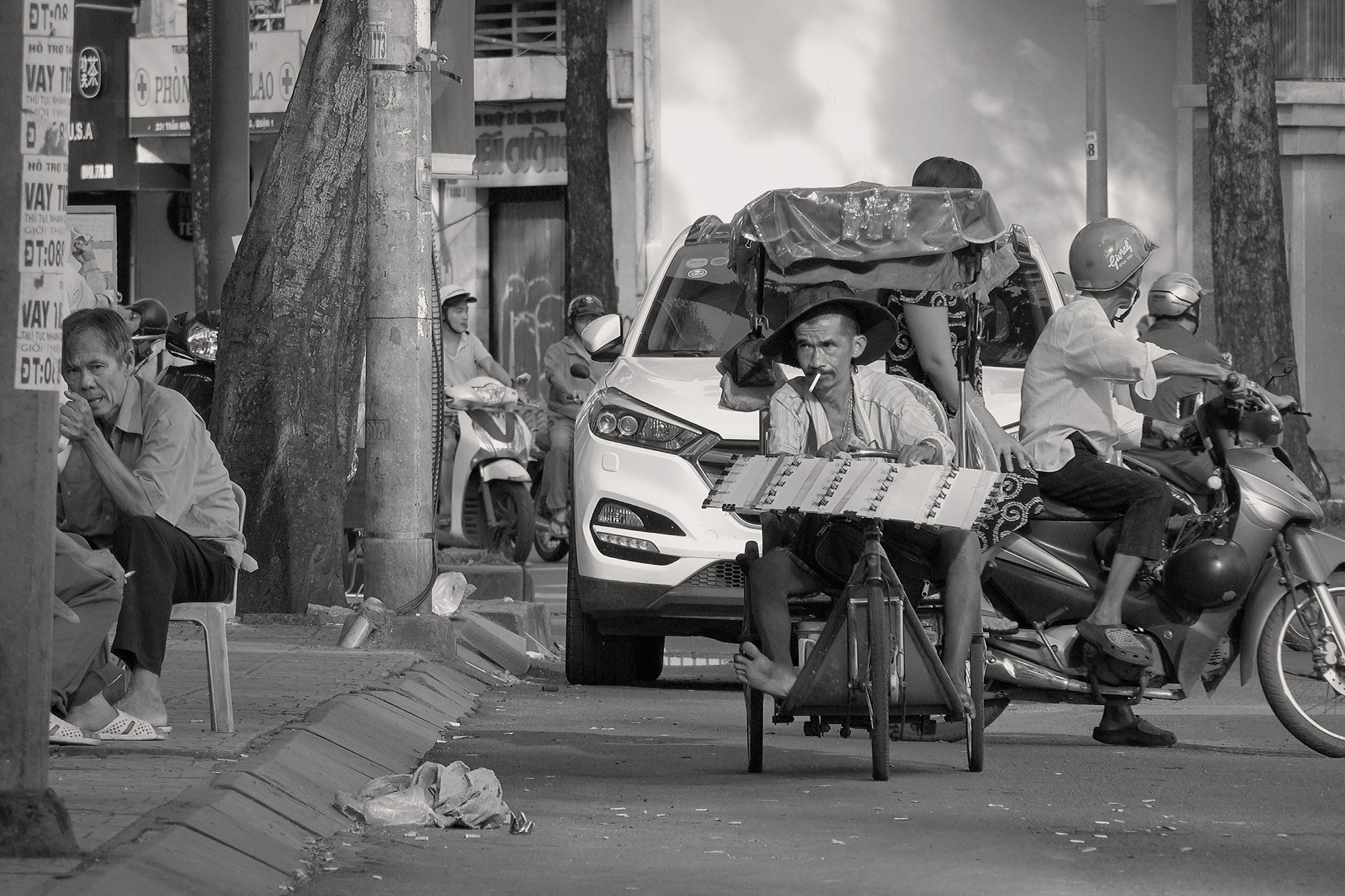 Christoph Radke, Vietnam, Saigon, behinderte Mann audf einem Dreirad, 2018